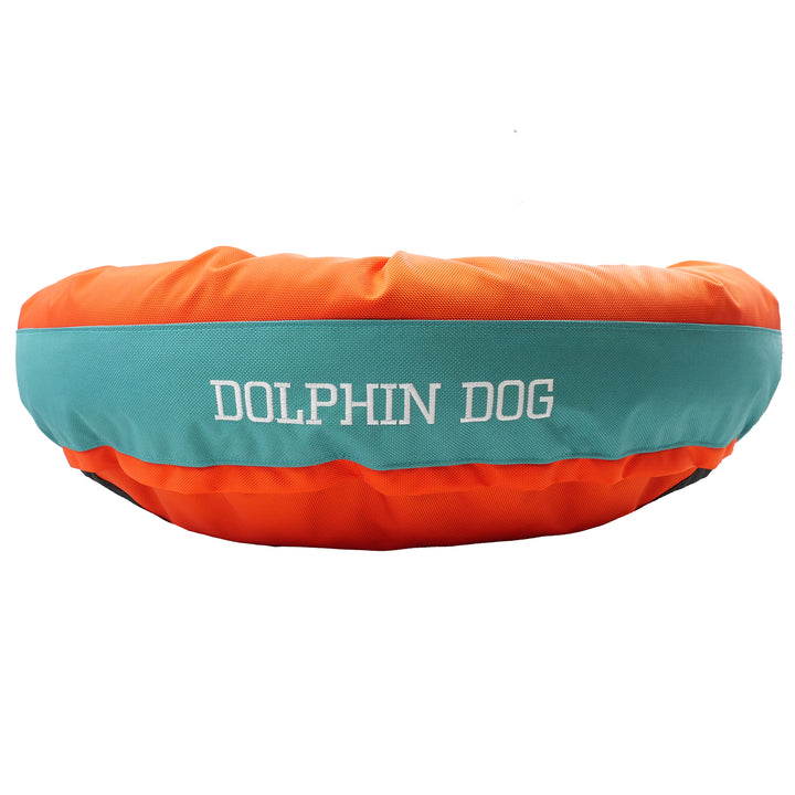 orange & teal round bolster dog bed with embroidered 'dolphin dog' in white