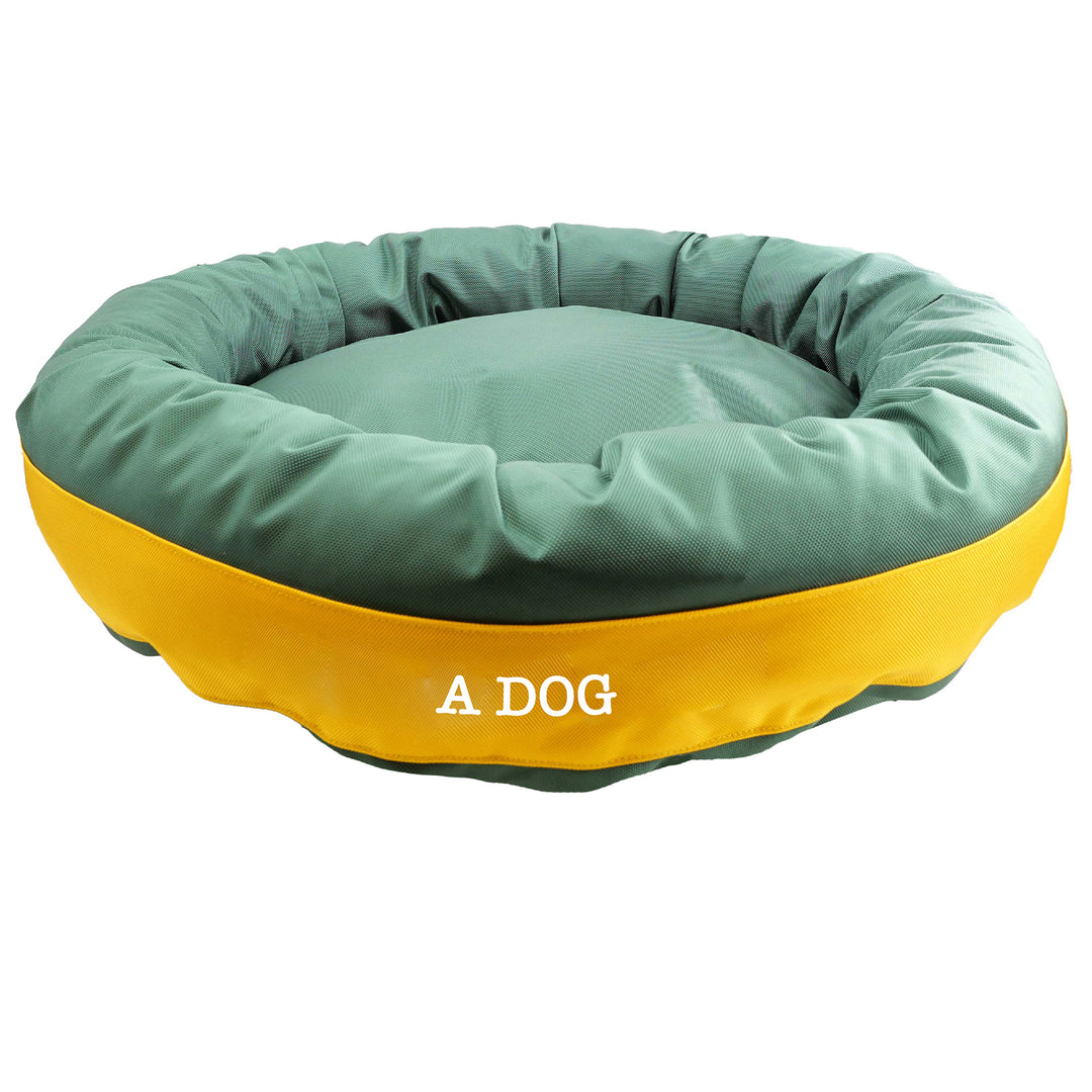 Side view of green dog bed with gold center band. 'A Dog' embroidy