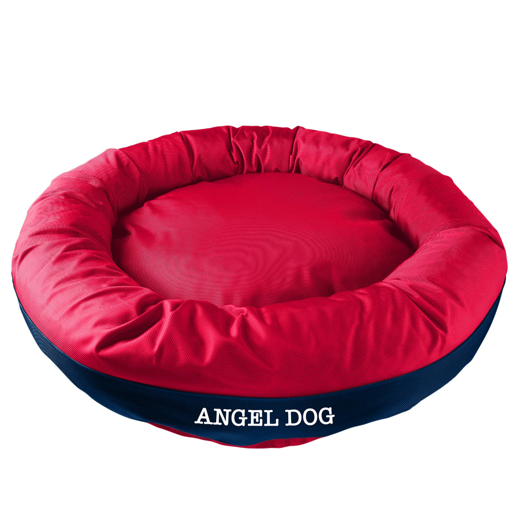 Red dog bed with navy band in the center with 'Angel Dog' embroidered in white.