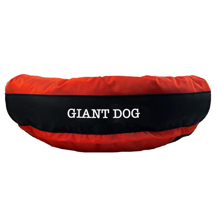 Orange round bolstered dog bed with black band and white embroidered 'Giant Dog'.