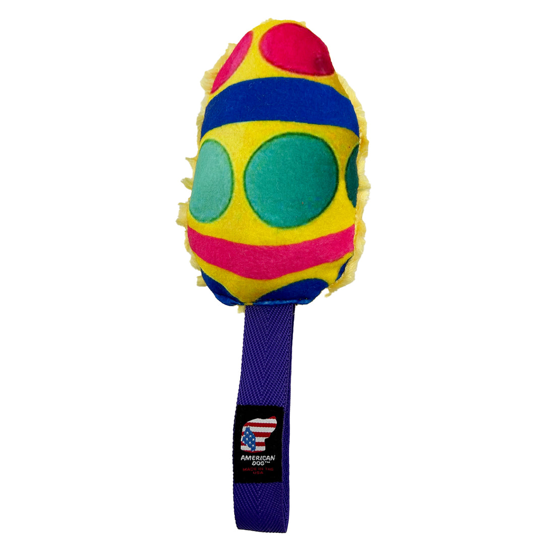 Yellow egg shape with teal and pink circles and a blue and pink stripe