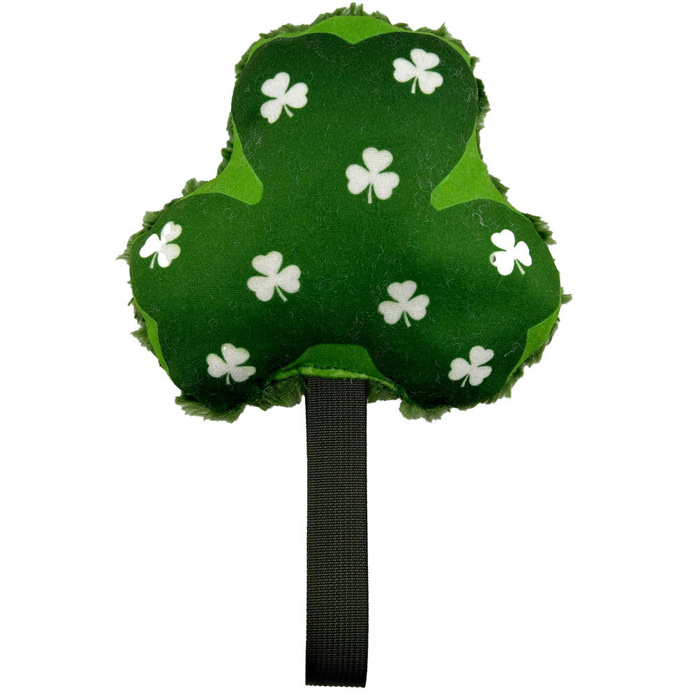 Green fleece in the shape of a Shamrock and with a green handle.  Little white shamrock in the center