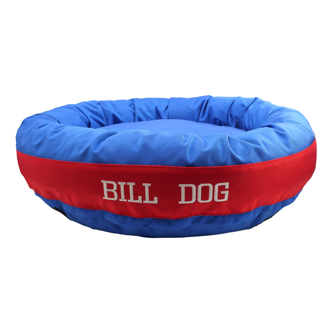 Blue and red bolstered dog bed with Bill Dog embroidered in white