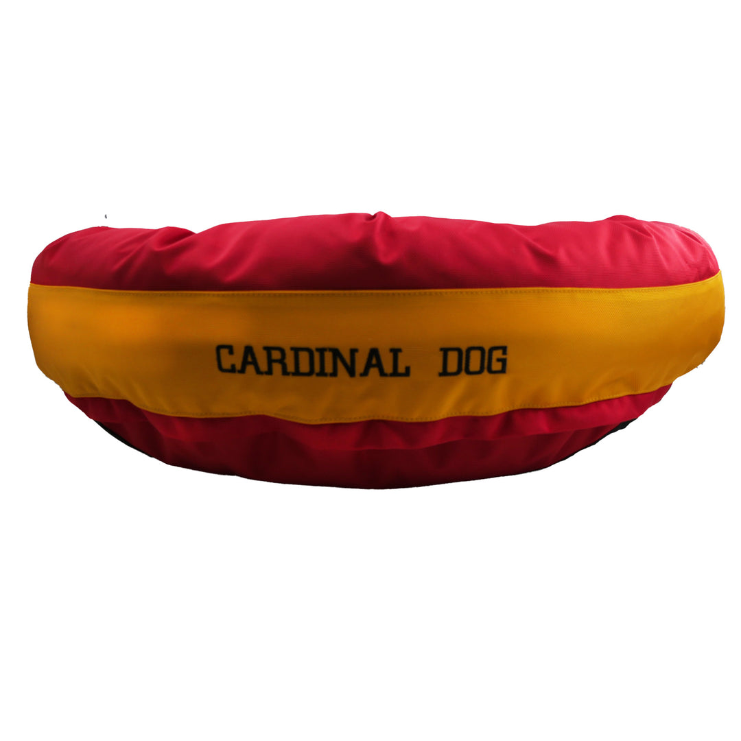 Red round bolstered dog bed with a yellow band with black embroidered 'CardinalDog'