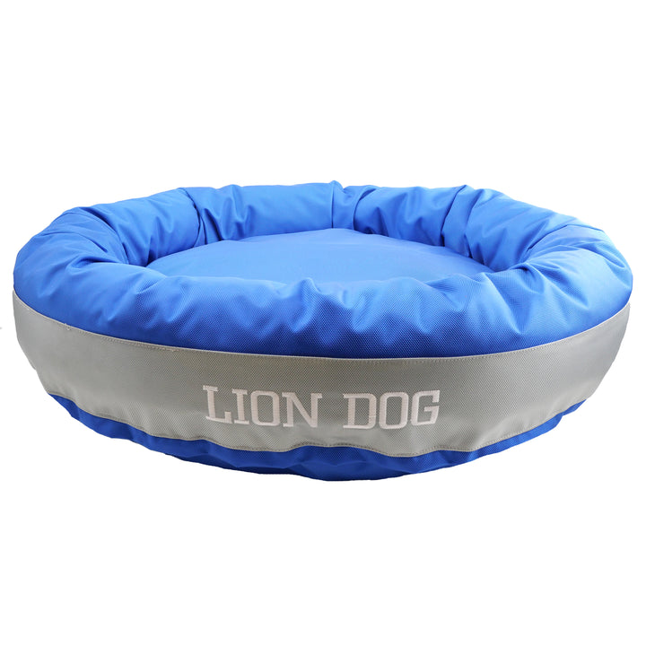 Blue and silver bolstered dog bed with 'Lion Dog' embroidered